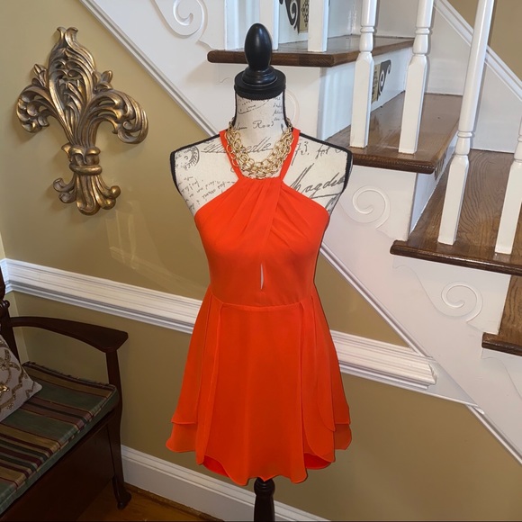 bebe Dresses & Skirts - BEBE halter dress with flutter ruffle skirt